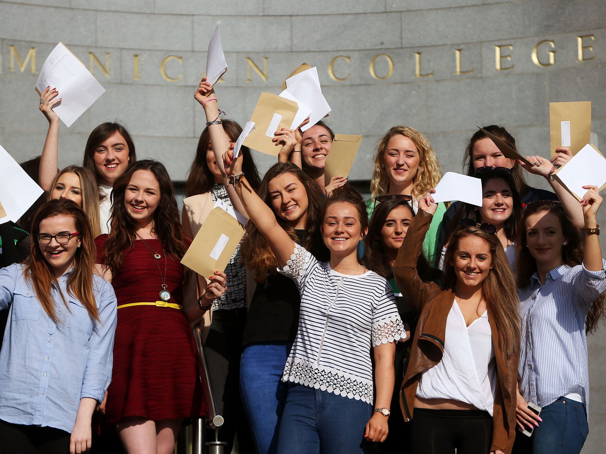 Students celebrate their A-level results at Dominican College in Belfast