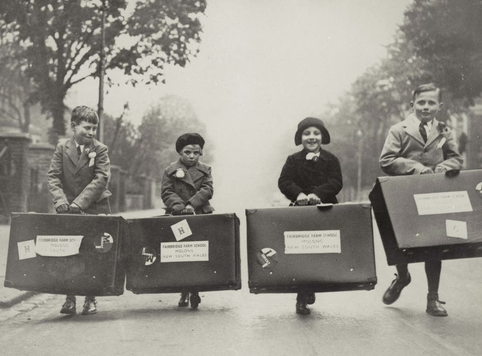 Four children with Fairbridge Farm suitcases, from Child Migration exhibition