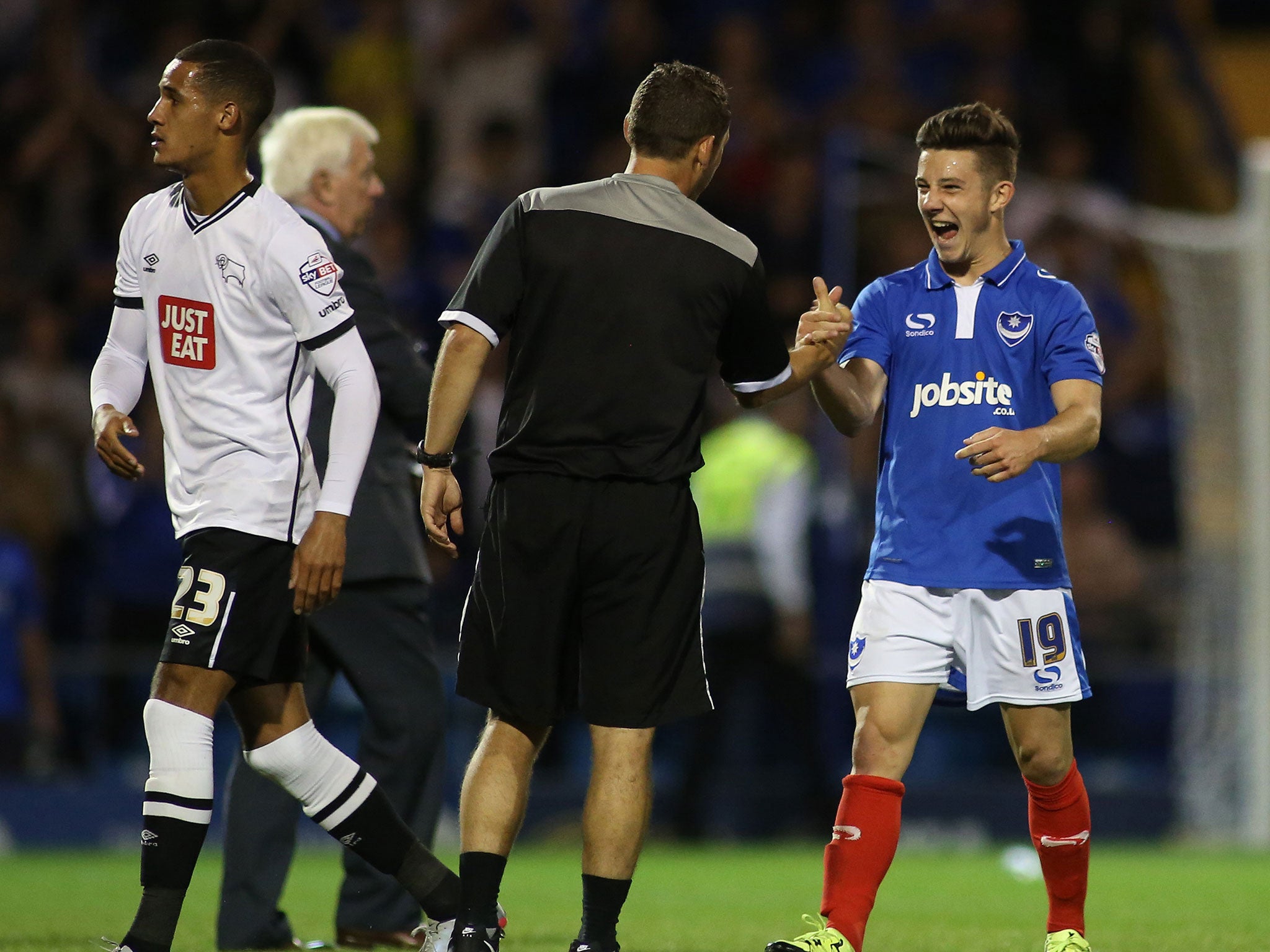 Portsmouth’s 18-year-old striker Conor Chaplin (right) is congratulated  at the final whistle after scoring their winner against Derby on Wednesda