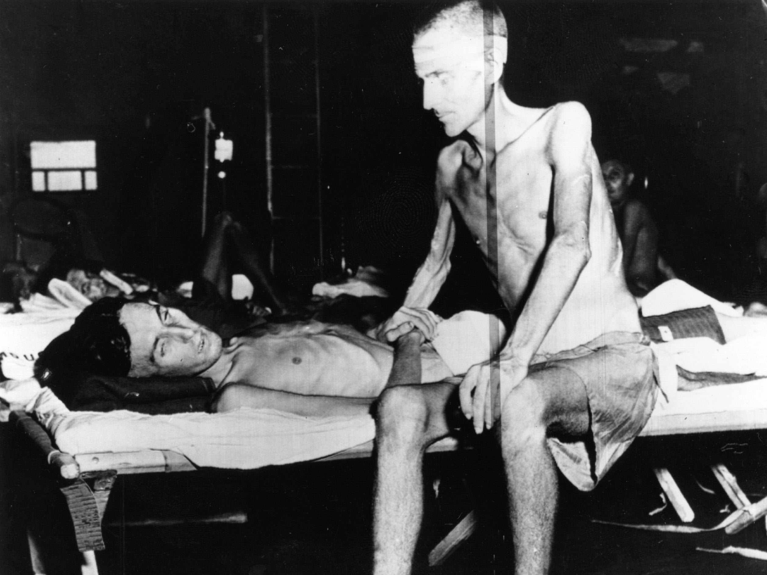 Emaciated English soldiers liberated from a Japanese prison camp