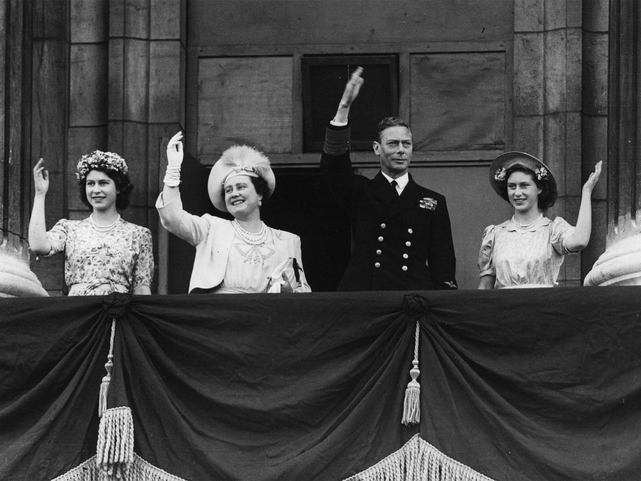 The Queen (then Princess Elizabeth), the then Queen Elizabeth, King George VI and Princess Margaret on 15 August 1945 (Getty)