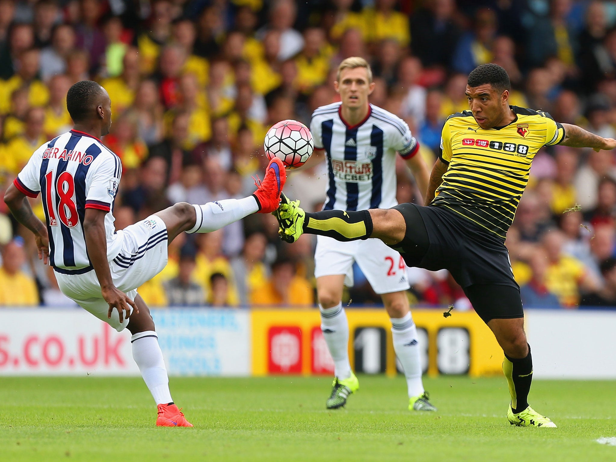 Troy Deeney challenges Saido Berahino during Watford's clash with West Brom