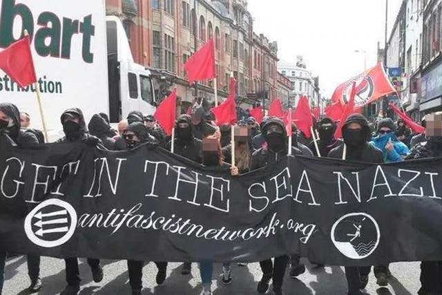 Anti-Fascism protesters carry a banner through Liverpool which reads 'Get in the sea, Nazis'