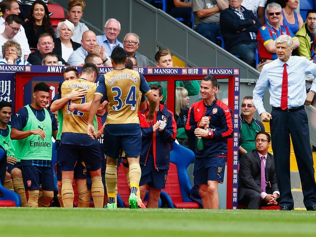 Arsenal players celebrate the opening goal