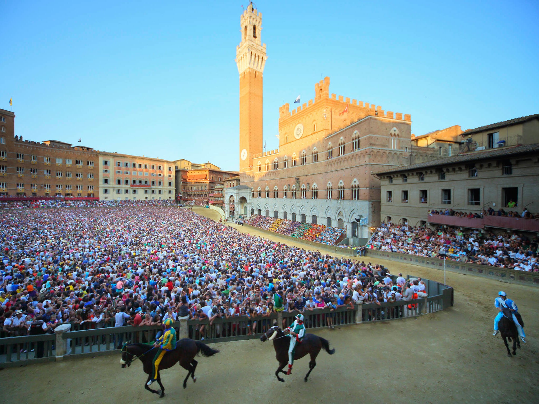 Riders take part in a practice race in Siena