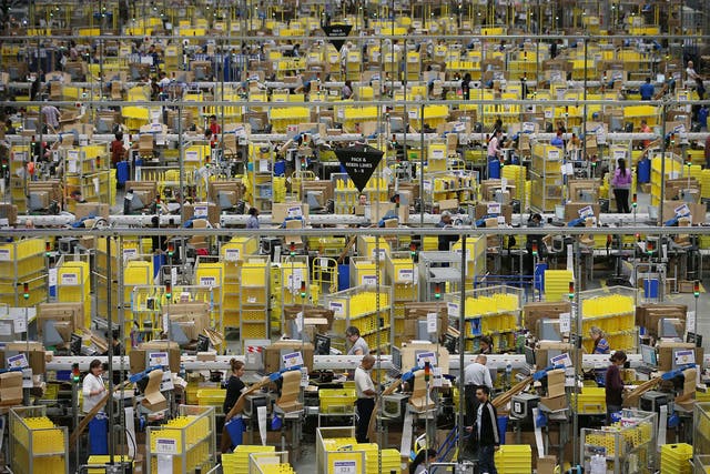 Parcels being prepared for dispatch at Amazon’s warehouse in Hemel Hempstead, Hertfordshire