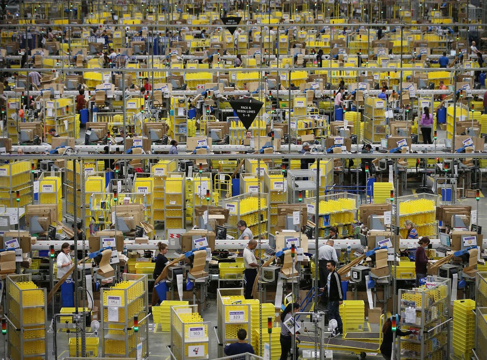 Parcels being prepared for dispatch at Amazon’s warehouse in Hemel Hempstead, Hertfordshire