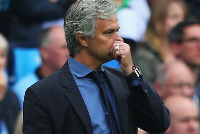 A frustrated Jose Mourinho looks on from the stands