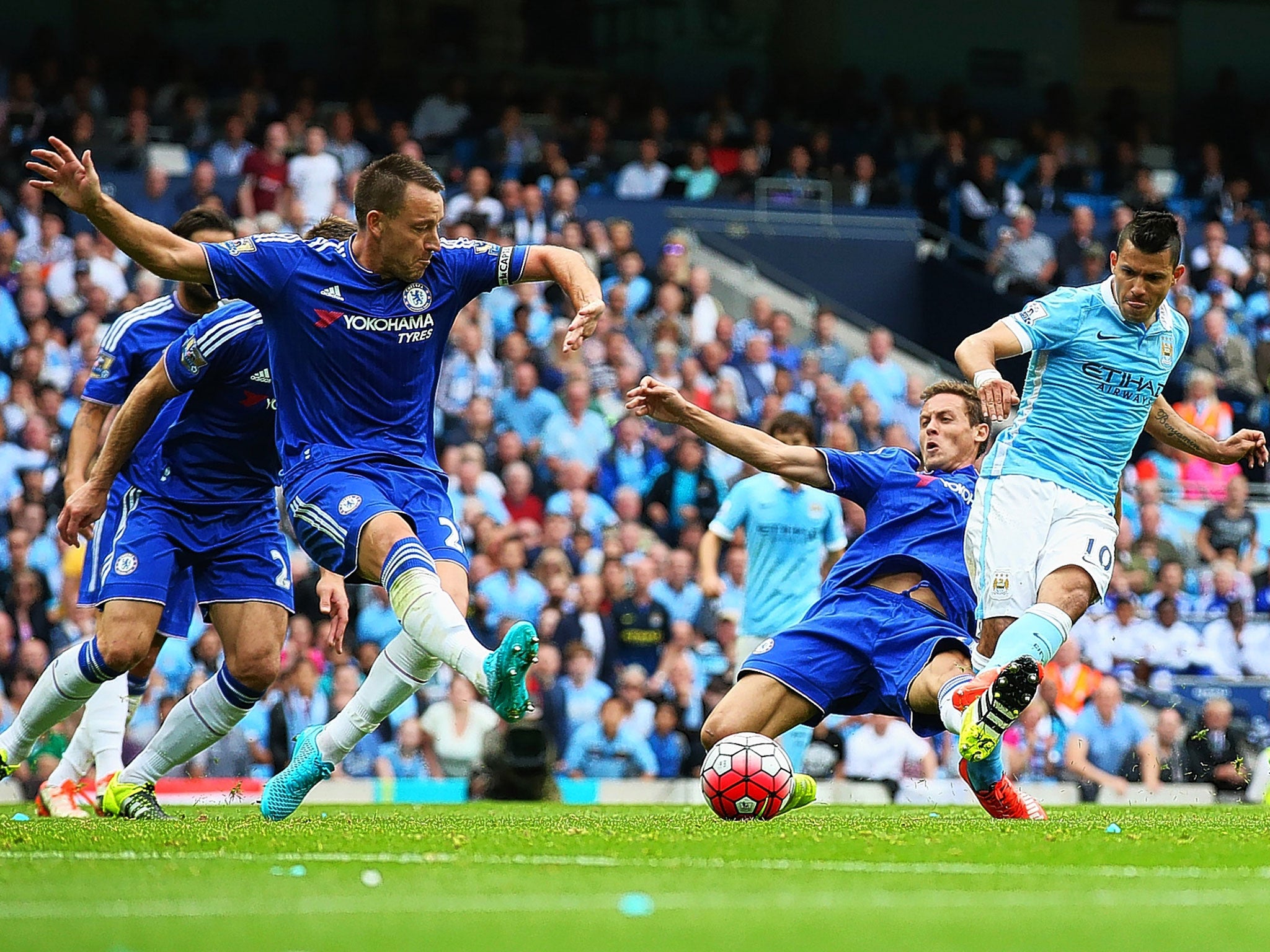 Chelsea captain John Terry (left) cannot stop Sergio Aguero putting Manchester City in front