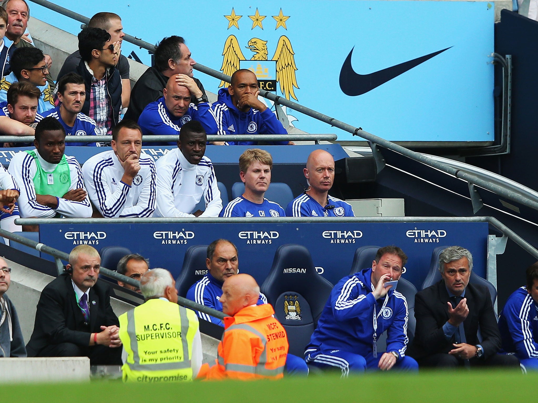John Terry looks on from the bench after being substituted