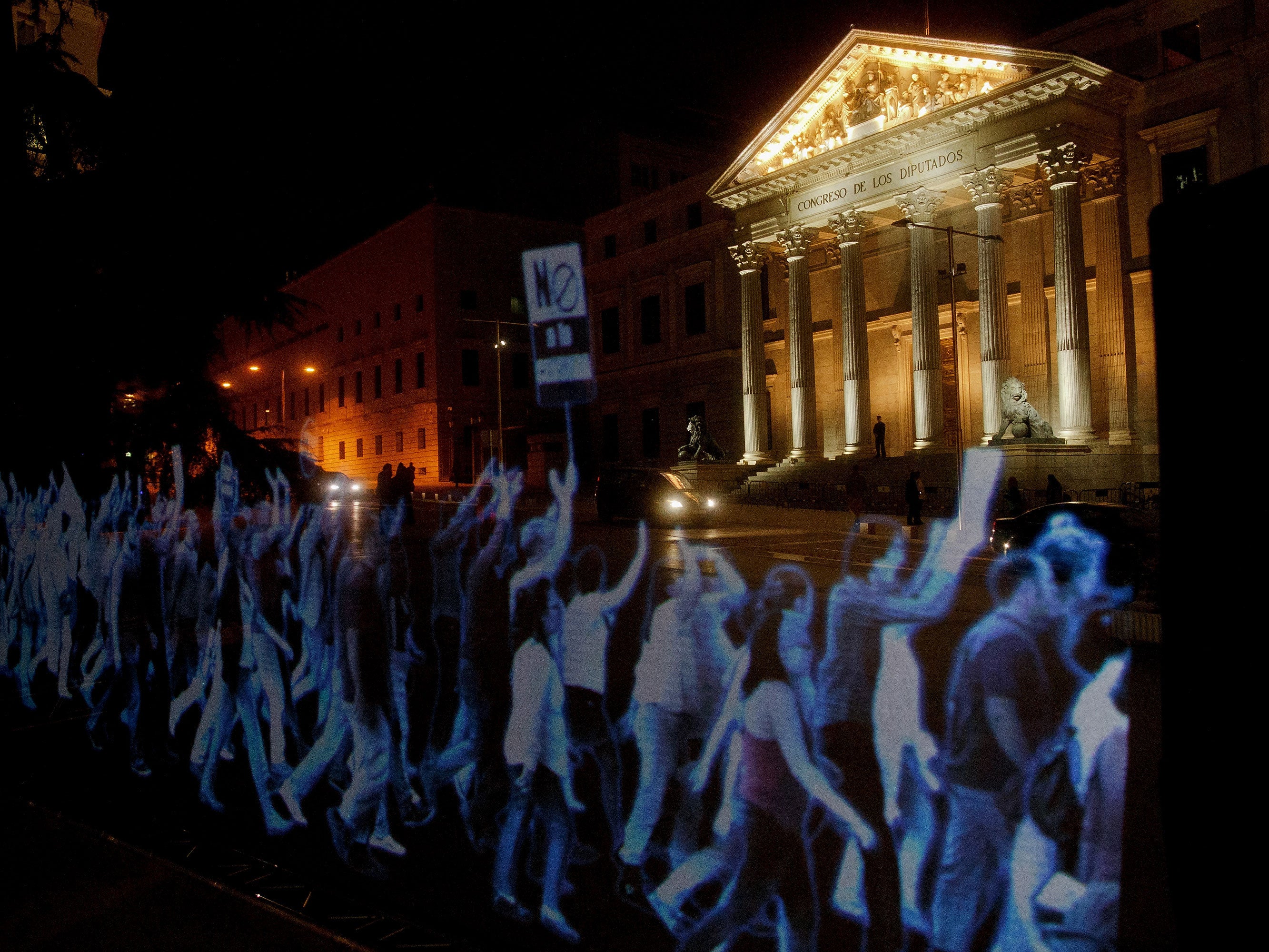 Holographic protest against gag law at spanish parliament