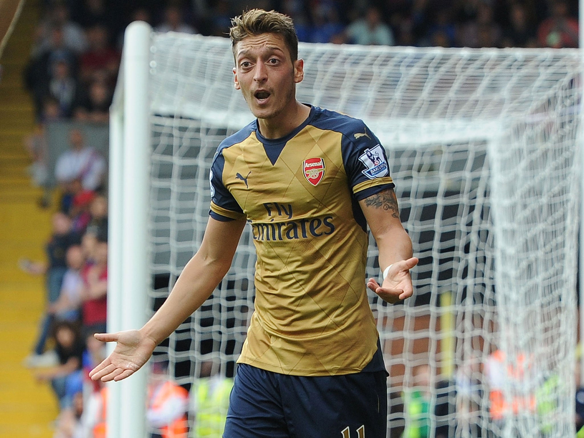 Mesut Özil gestures during the win over Palace