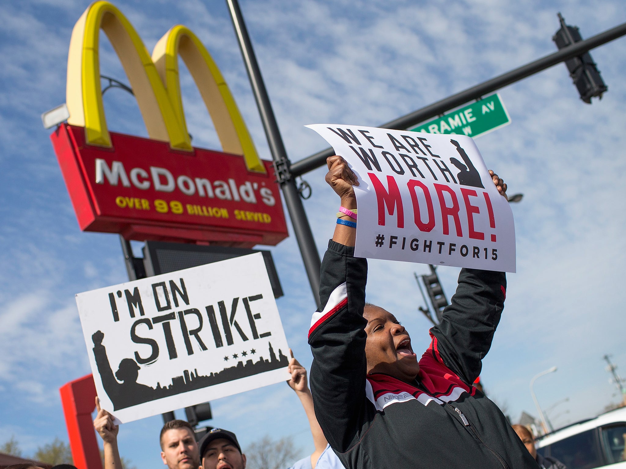 Burger-flipping robots become that much more cost-competitive if the current federal minimum wage of $7.25 an hour is doubled