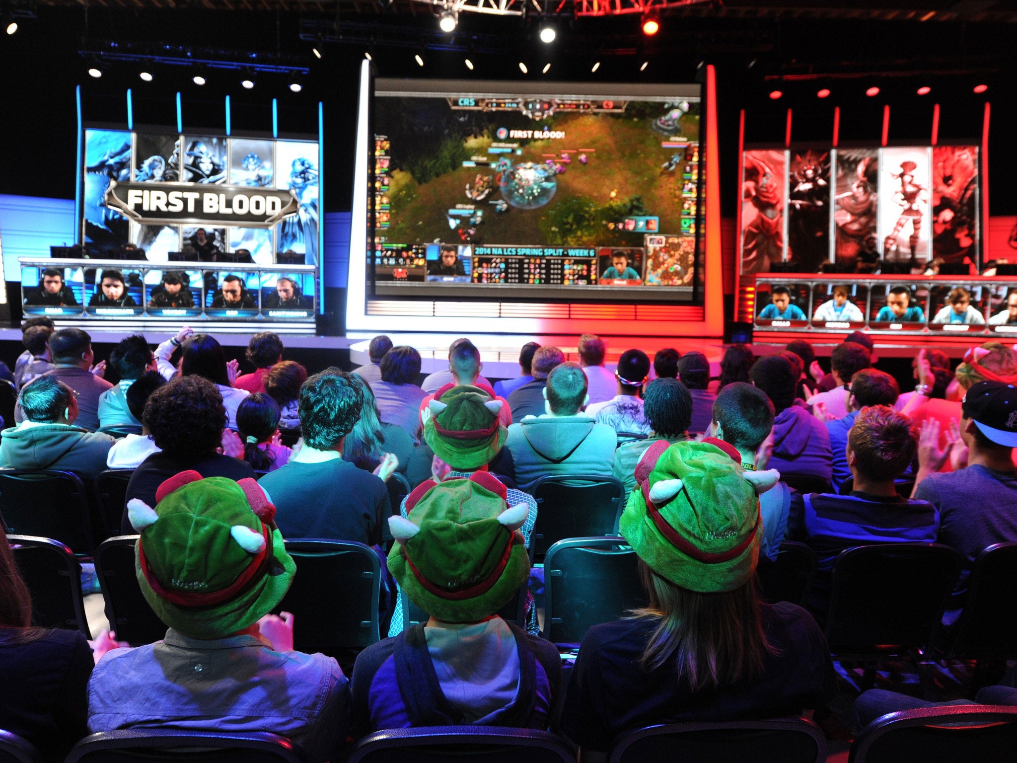 A studio audience watches a match between professional Team Curse and Cloud 9 during the League of Legends North American Championship Series in 2014