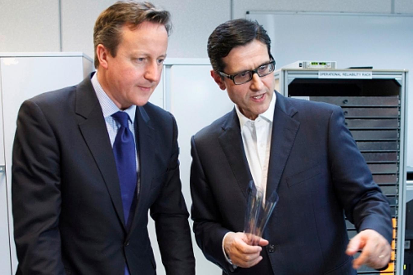 Drawing a line: New Quindell boss Indro Mukerjee, as chairman of FlexEnable, meets David Cameron in Cambridge