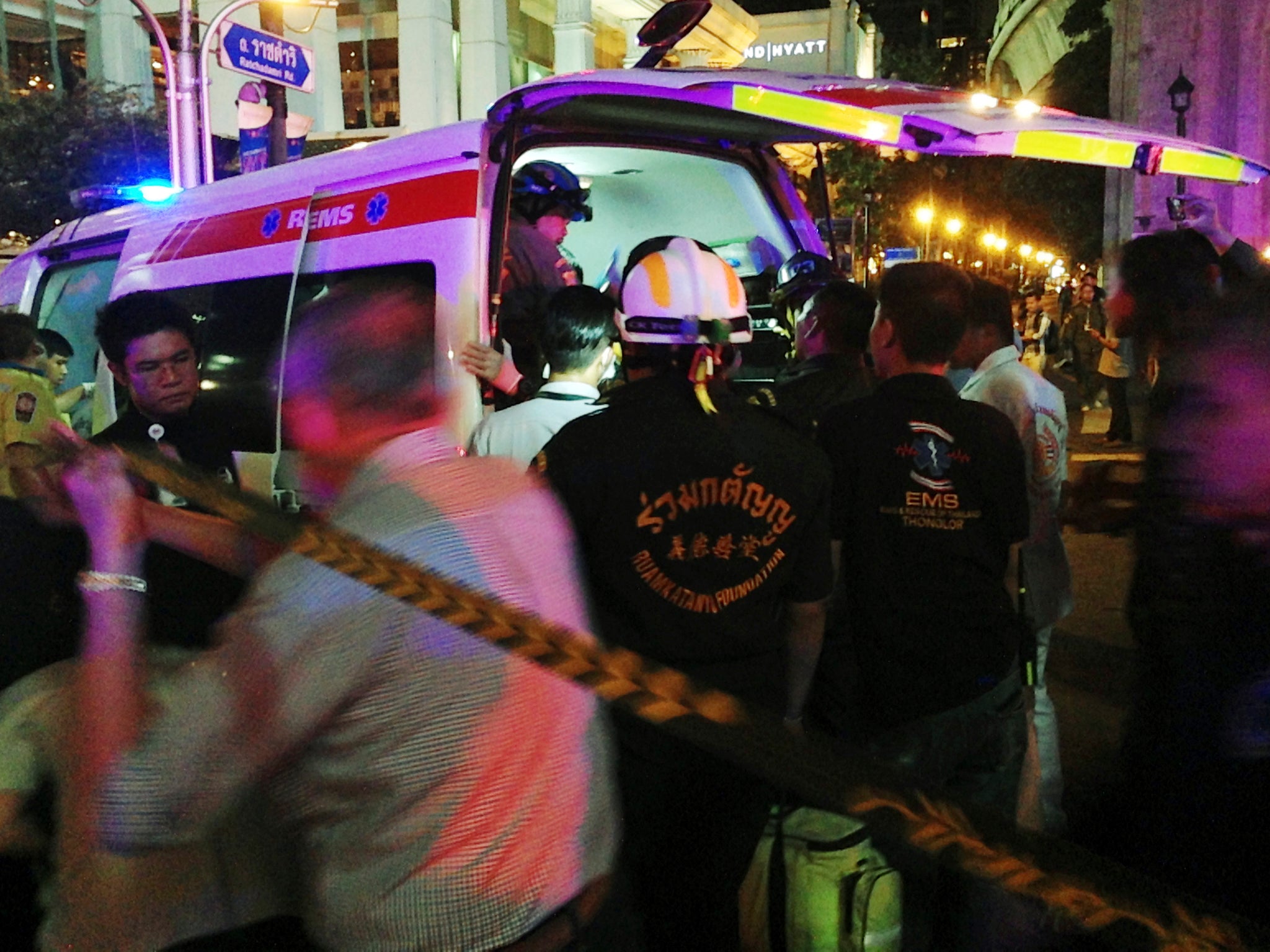 Emergency workers attend to the wounded following the explosion -