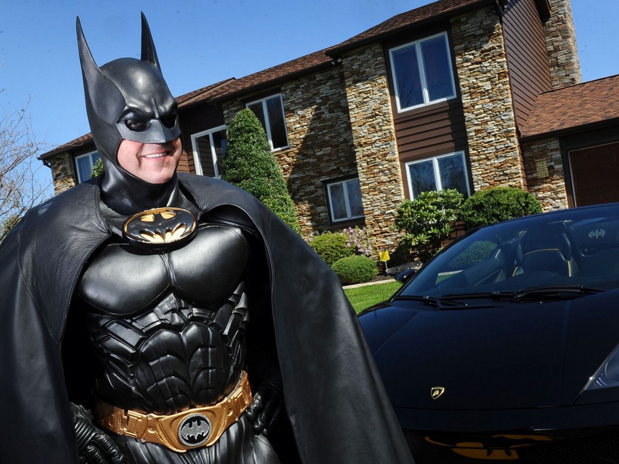 Lenny B. Robinson dressed up as Batman to hand out gifts at hospitals