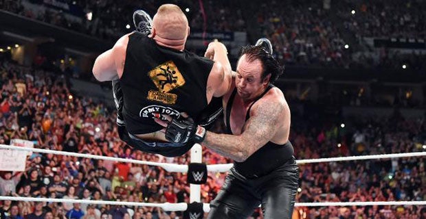 The Undertaker lands a chokeslam on Lesnar