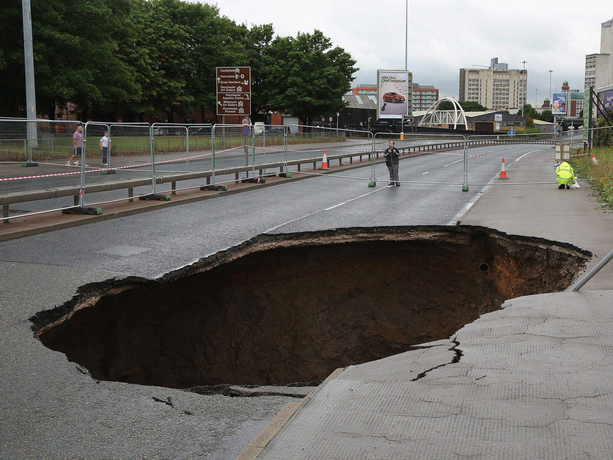 The sinkhole suddenly appeared on a busy Manchester road on Friday