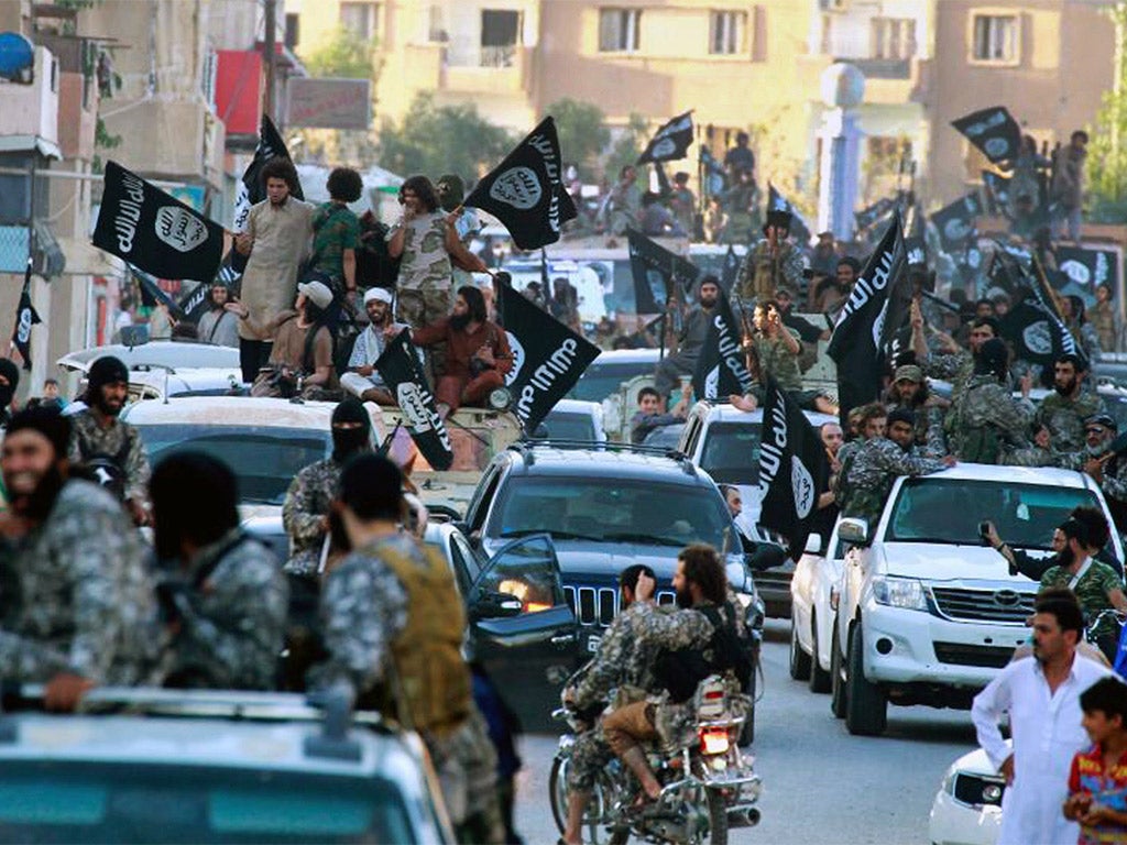 Fighters from Isis parading in Raqqa, northern Syria, where the ‘Islamic State’ has its capital.