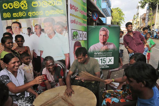 Supporters of Sri Lanka’s United National Party celebrate victory in Colombo 