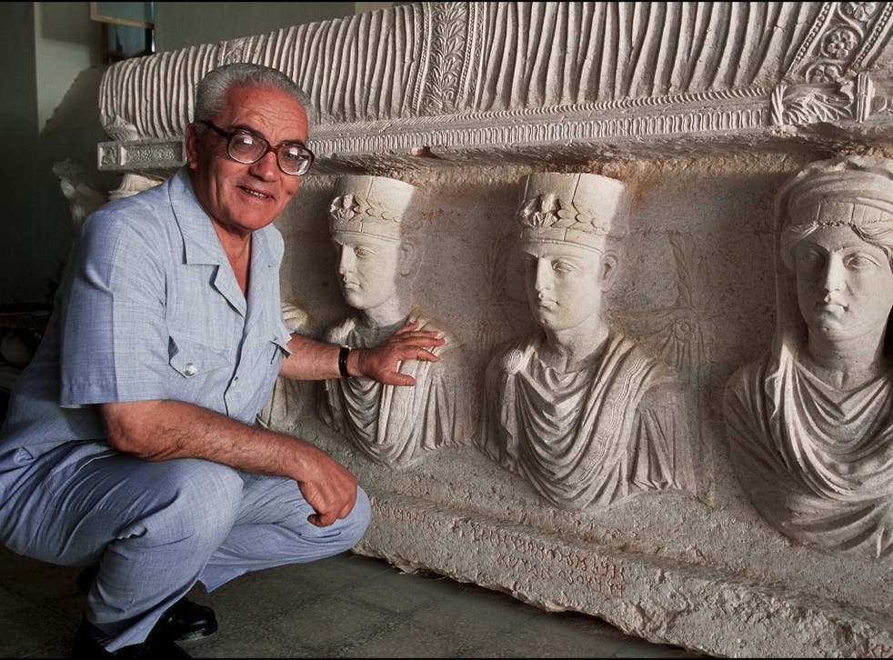 File: Khaled Asaad, the Director of Antiquities and Museum in Palmyra, in front of a rare 1st century sarcophagus, one of the finest sculptures in Palmyra