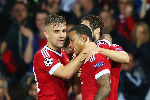 Memphis Depay celebrates his second goal with Luke Shaw