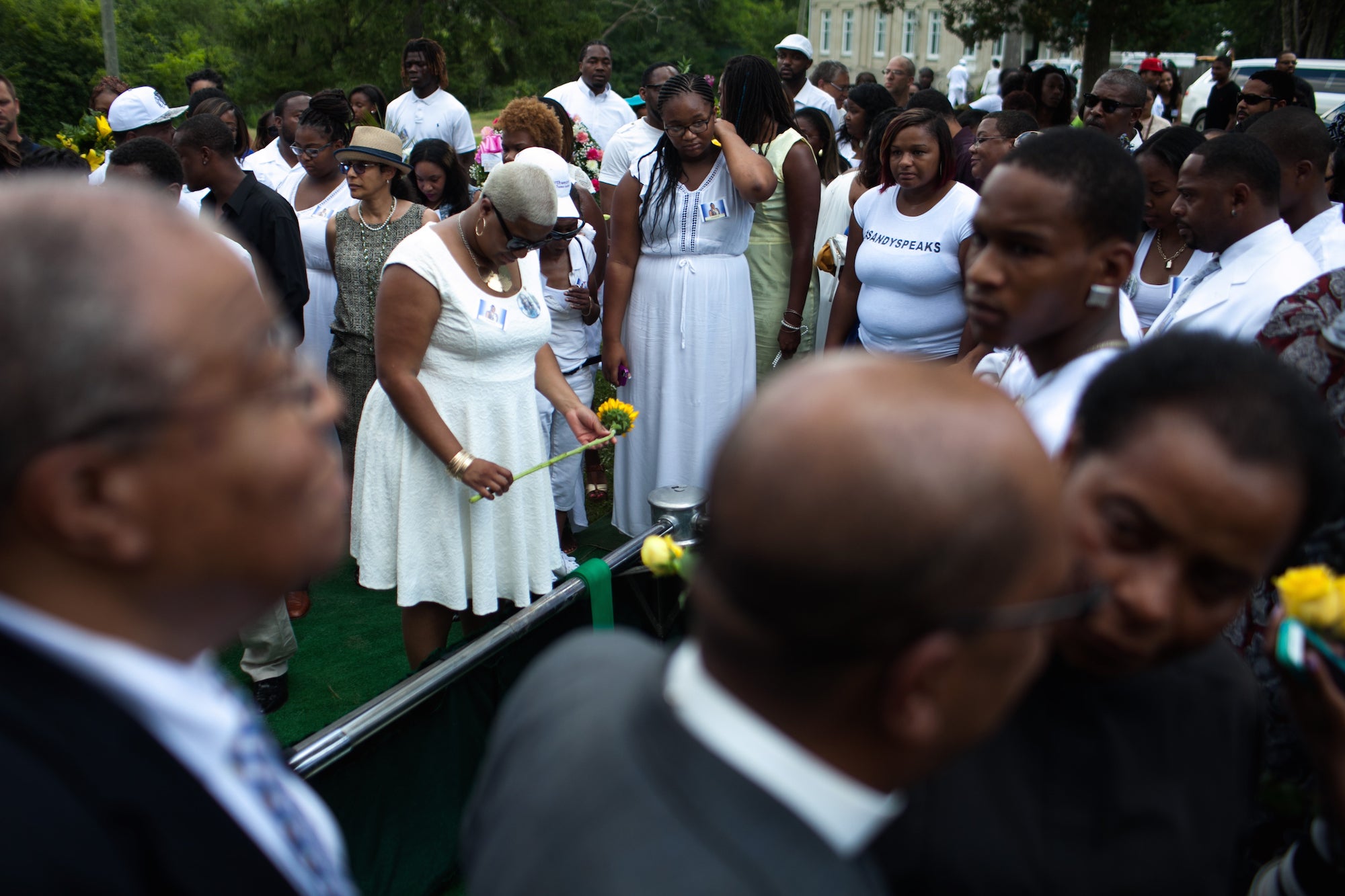 Shavon Bland, attends her sister Sandra's funeral on 25 July.