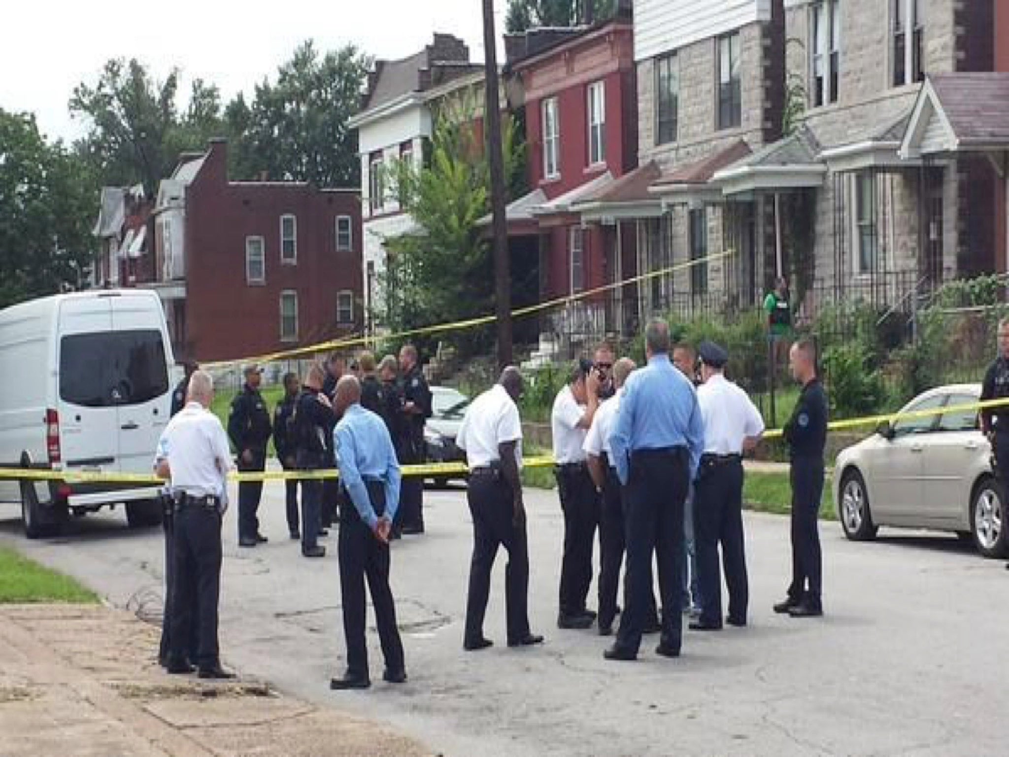 Police gathered at the scene of the shooting in north St Louis