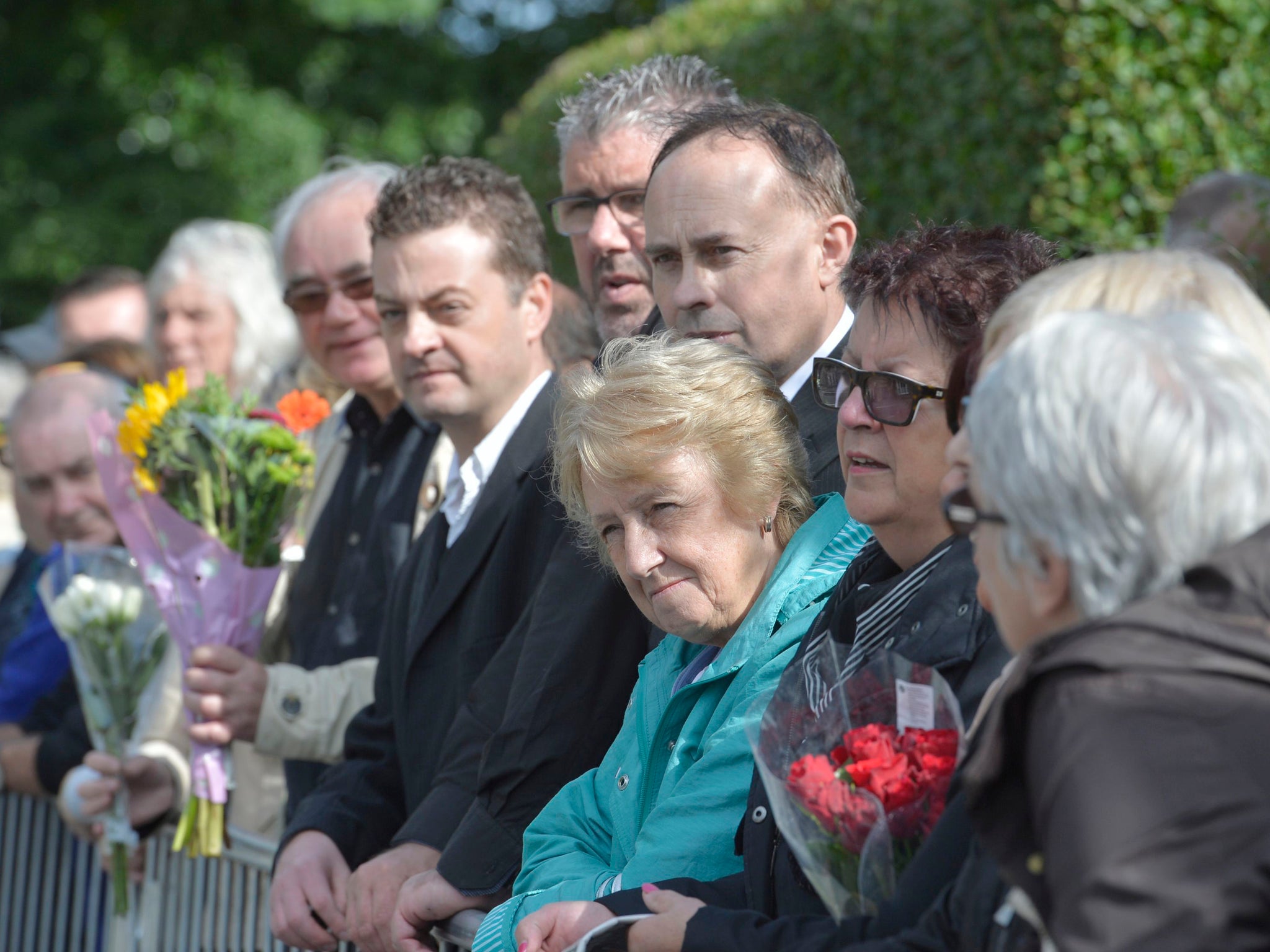 Members of the crowd as they wait for the start of funeral for Cilla Black at St Mary's Church in Woolton, Liverpool.