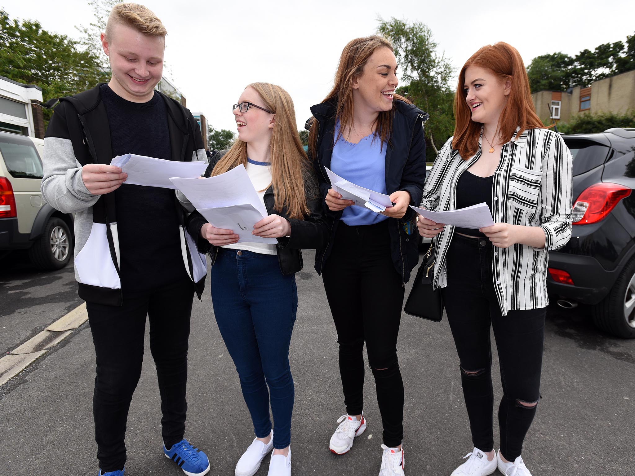 Emily Mott with her friends, receiving their results