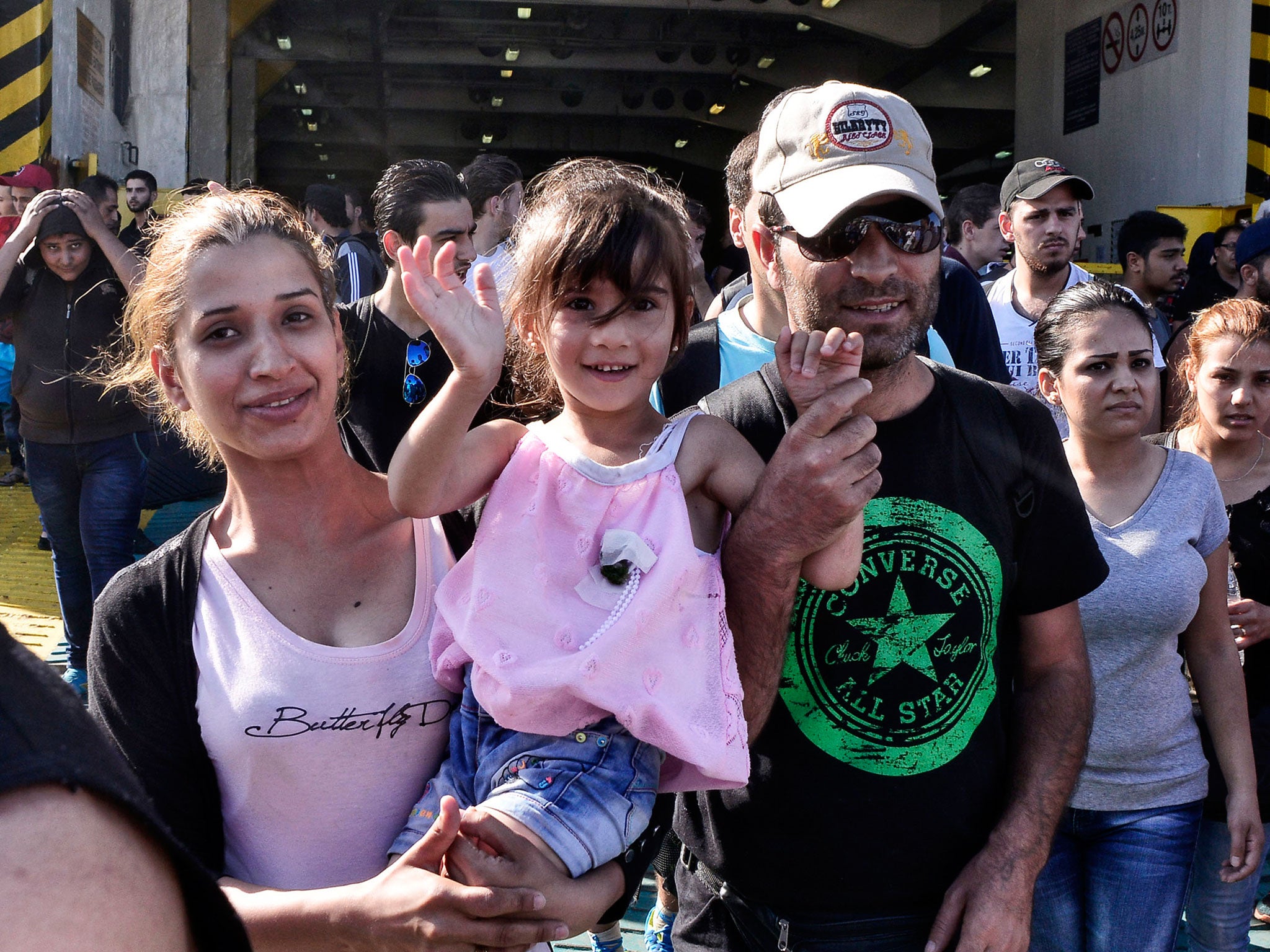 Syrian migrants arrive into Athens after being transported from the Greek islands on a ferry carrying approximately 2,600 migrants