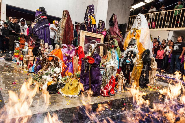 'Baptism of Fire, Pachuca, Mexico' - Santa Muerte statuettes are consecrated and baptised with tequila then set alight