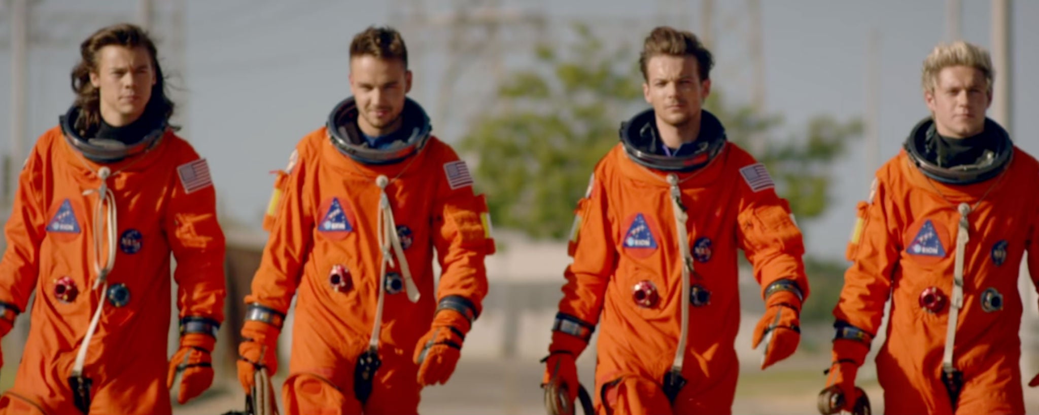 One Direction, minus Zayn Malik, don NASA spacesuits and board a rocket in the 'Drag Me Down' music video