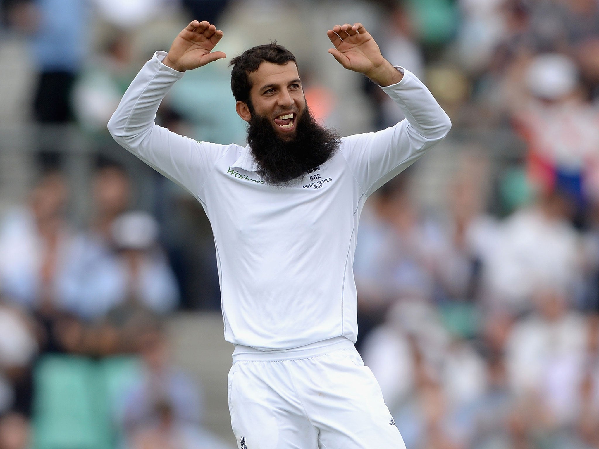 Moeen Ali celebrates taking the wicket of Peter Nevill shortly before lunch