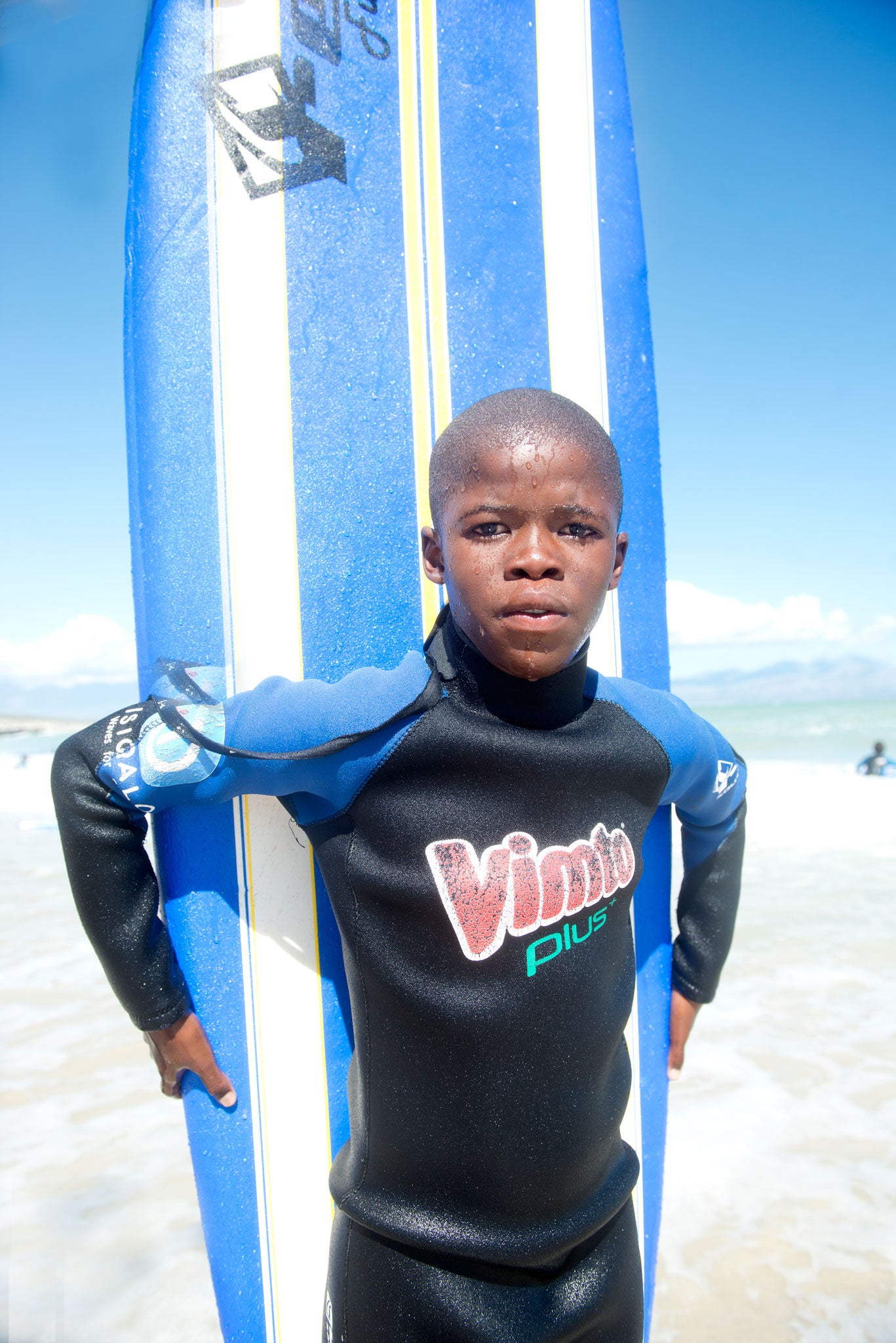 Nalo Mbhelwa at learning to surf at Monwabisi