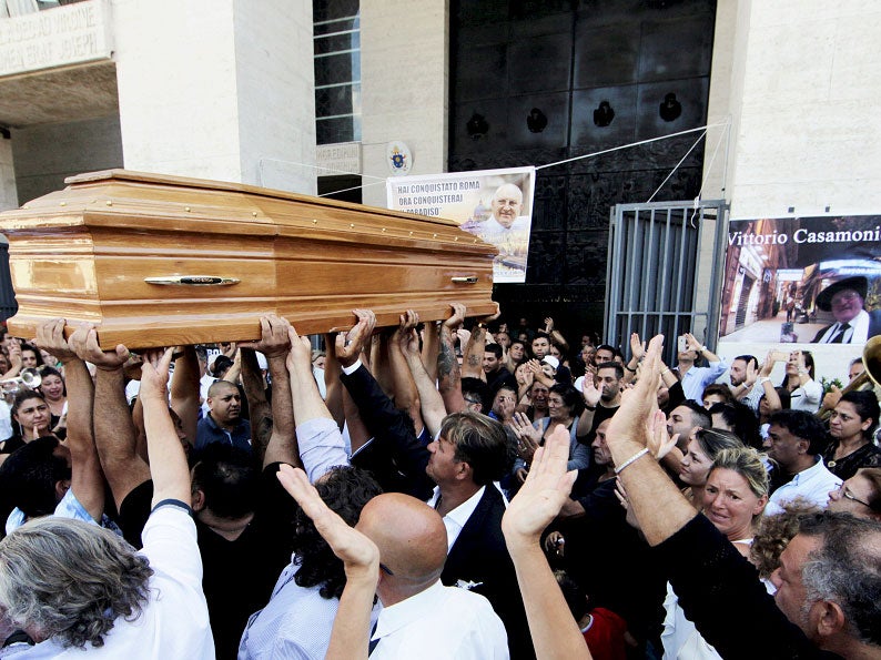 Mourners carry Casamonica's coffin