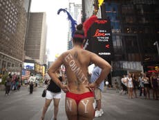 Times Square's 'naked ladies' on the run as New York Mayor Bill de