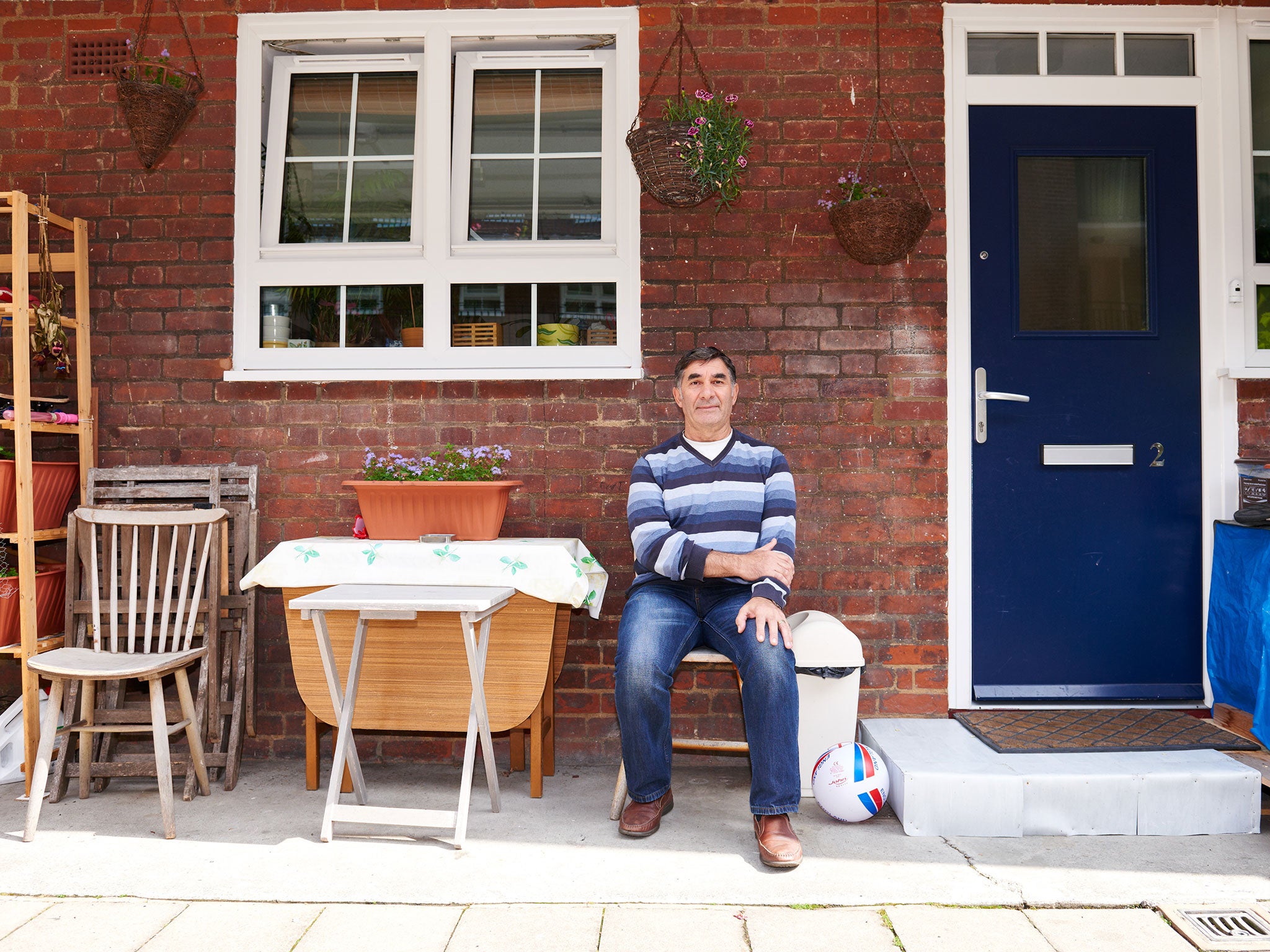 Hamit Ersozoglu in front of his house in the Andover Estate, Islington North