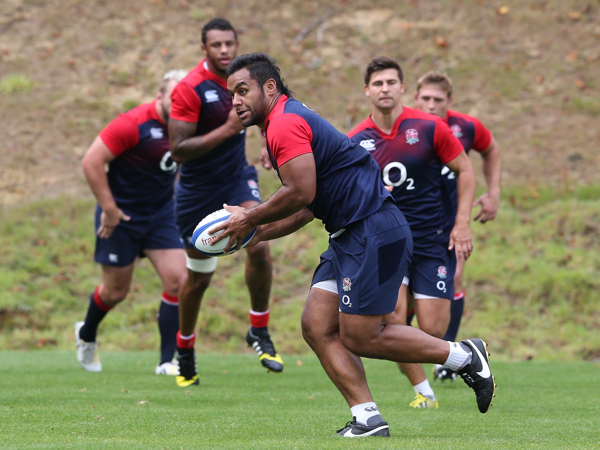 Billy Vunipola runs with the ball during the England training session held at Pennyhill Park on 20 August, 2015