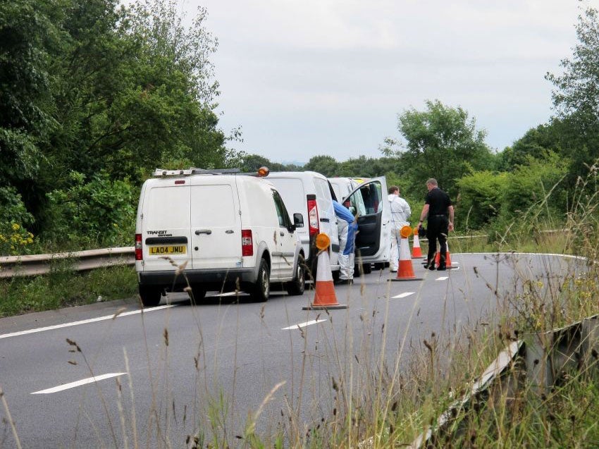 Police and forensics officers at the sliproad near to where the skull was discovered