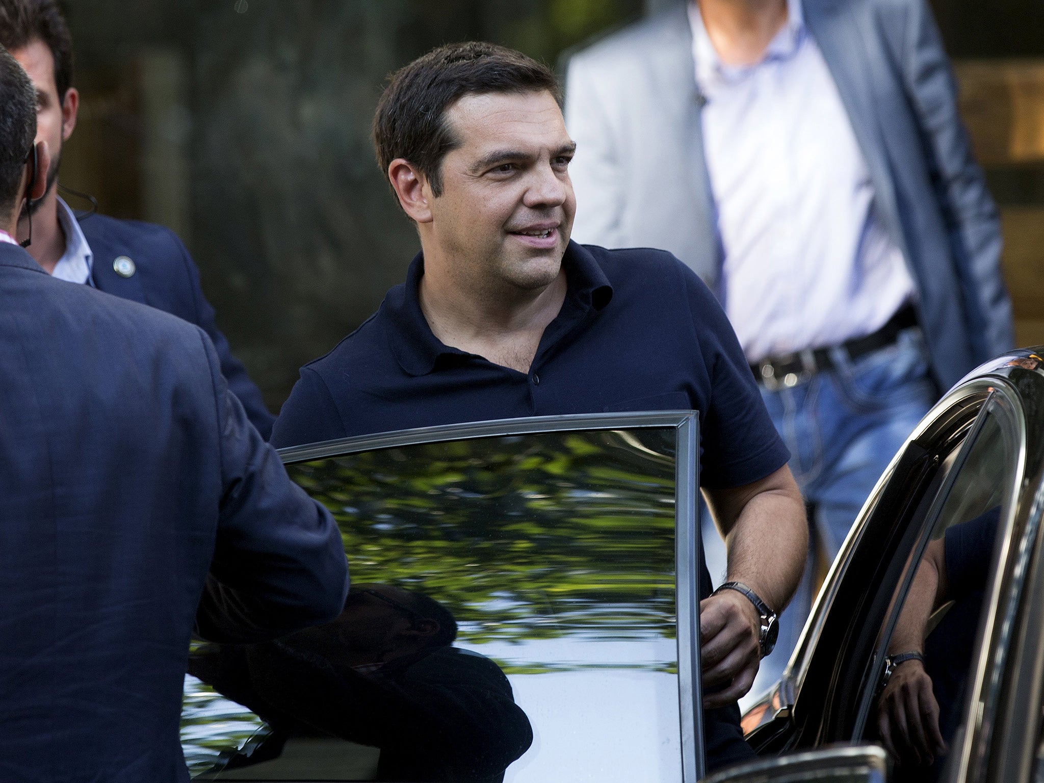 Greek outgoing Prime Minister Alexis Tsipras leaves his party's headquarters in Athens, Greece, August 21, 2015.