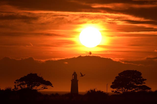 The sun rises over Whitley Bay, as hot and humid air is expected to be pushed into northern Europe this weekend, including Britain, creating a "Spanish Plume"
