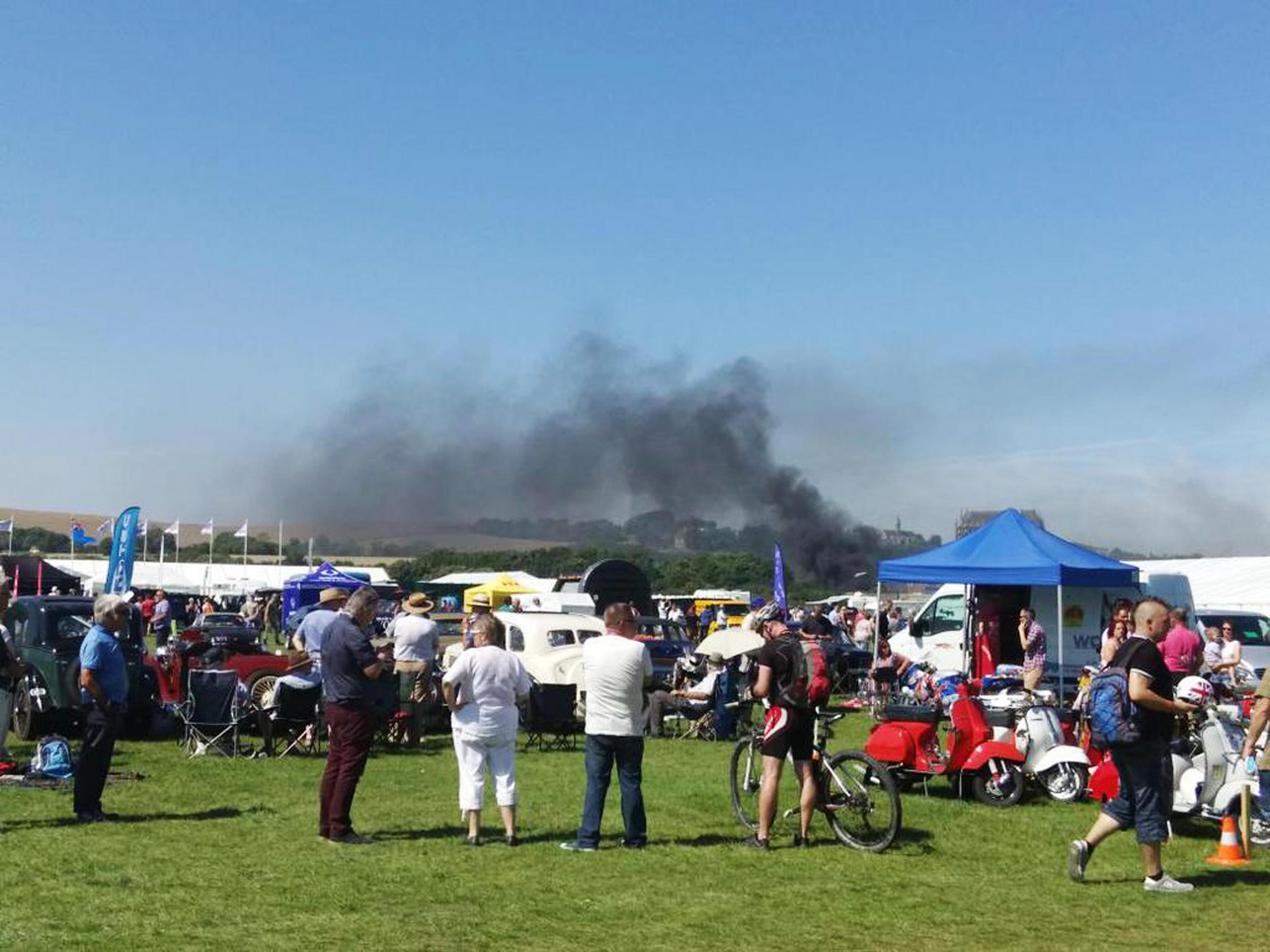 Smoke is seen following a crash involving a plane near Shoreham Airshow in West Sussex