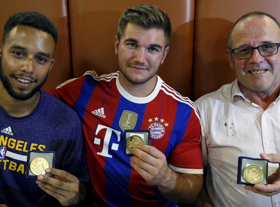  Anthony Sadler, Alek Skarlatos and Chris Norman with medals from the Mayor of Arras