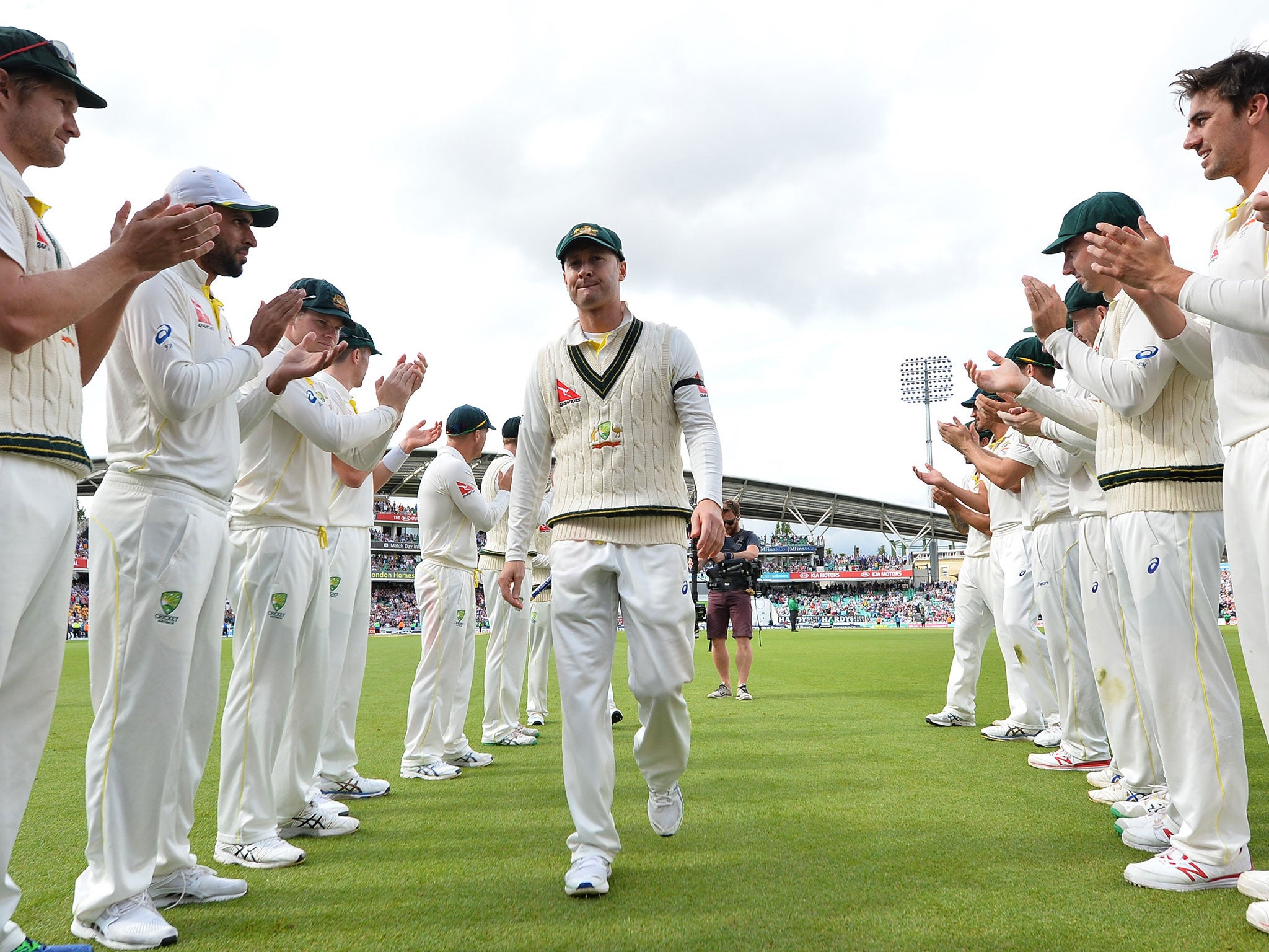 Australia's captain Michael Clarke receives a guard of honour from his Australia teammates as he leaves the field after Australia wrap up the game on the fourth day of the fifth Ashes cricket test match between England and Australia at The Oval