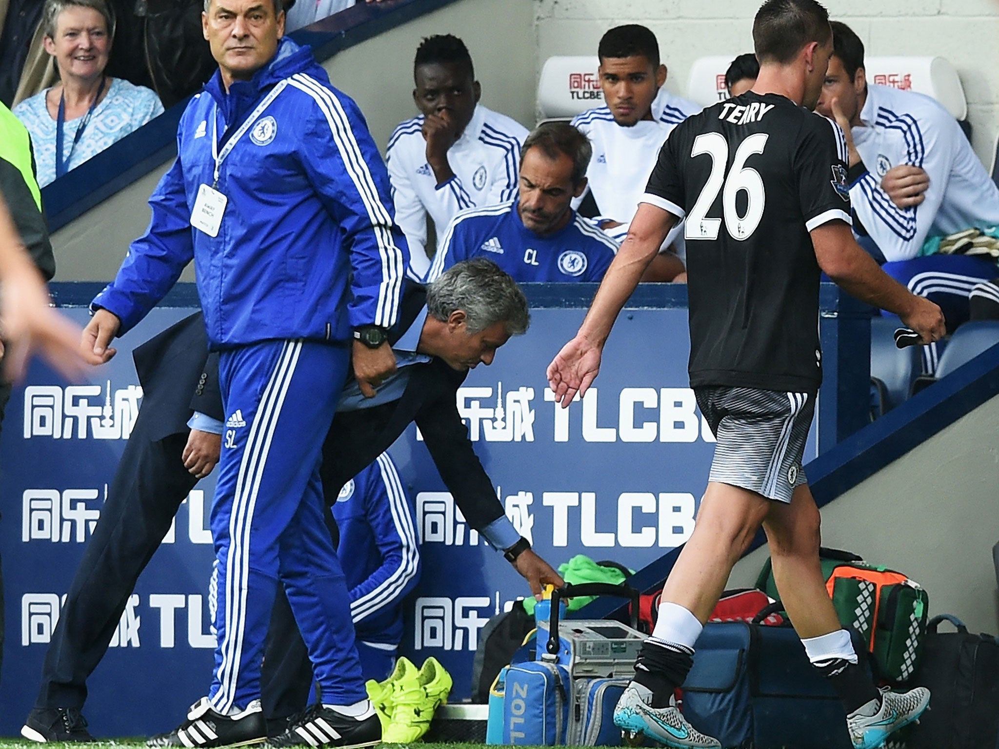 John Terry walks past Jose Mourinho after being shown a red card