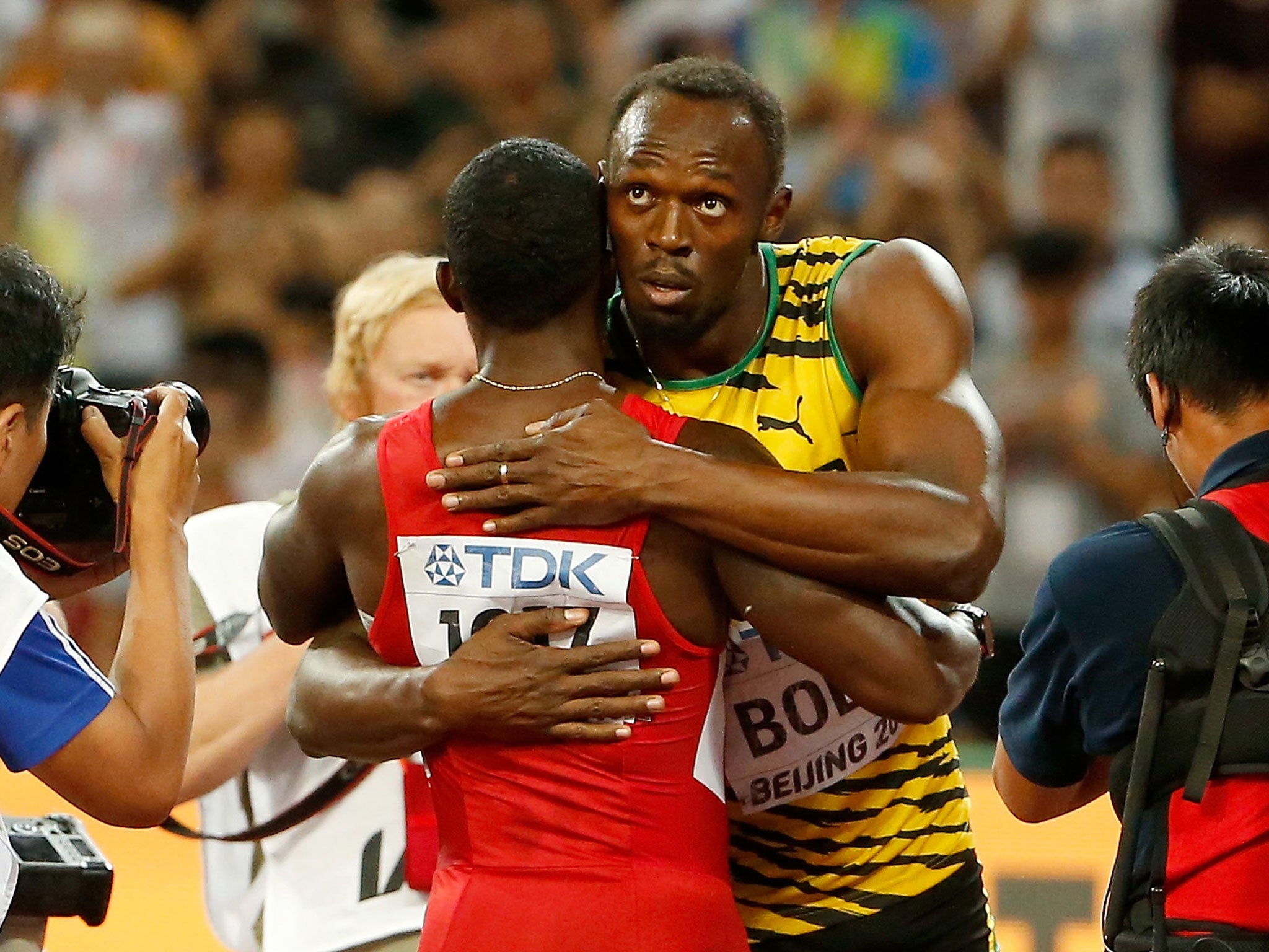 Usain Bolt of Jamaica is congratulated by Justin Gatlin