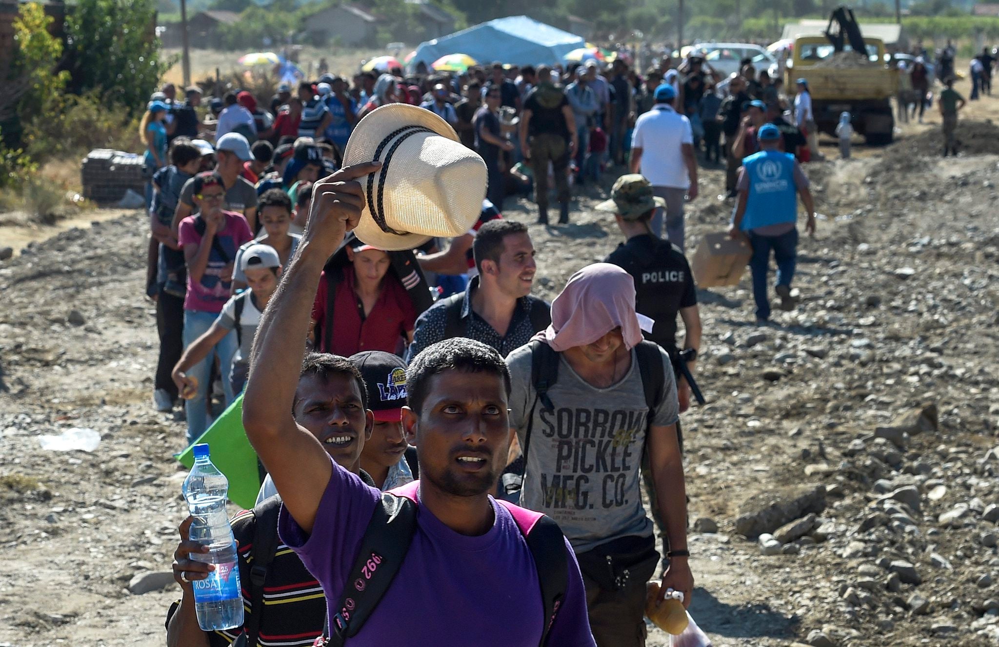 Migrants march across the border