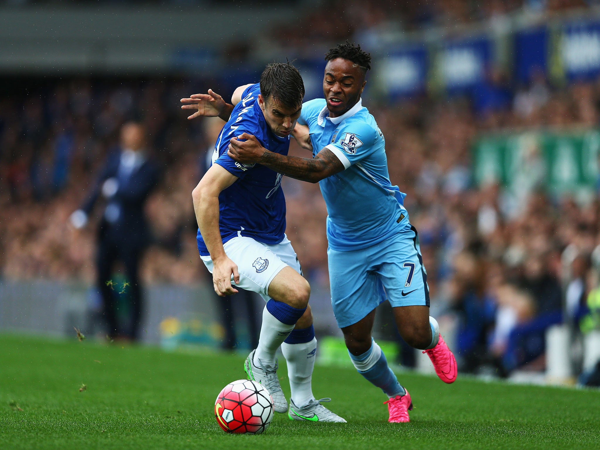 Raheem Sterling (right) battles with Seamus Coleman for the ball
